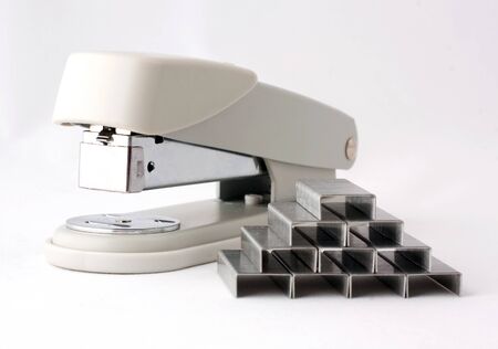 stapler and staples on a gray backgroundの写真素材