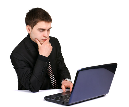 conceived businessman with laptop on desk on white backgroundの写真素材