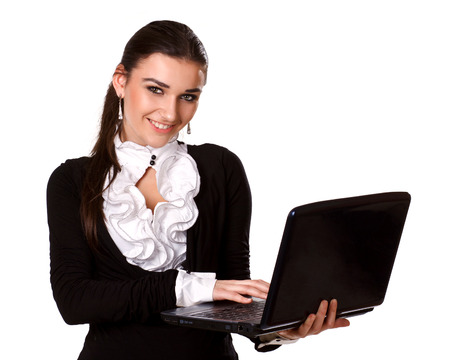 beautiful brunette in a business style with a laptop on a white backgroundの写真素材
