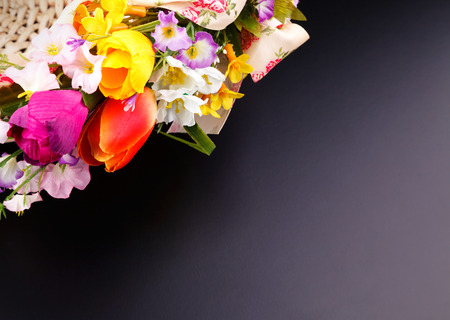 artifical flowers on a black backgroundの写真素材