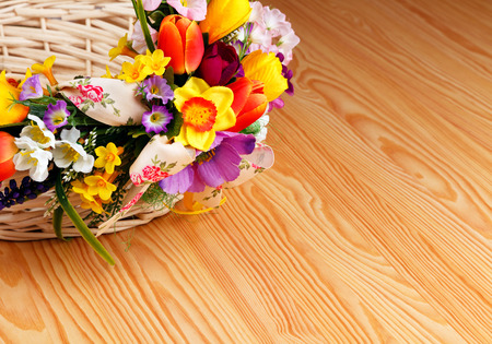 artifical flowers on a wooden backgroundの写真素材