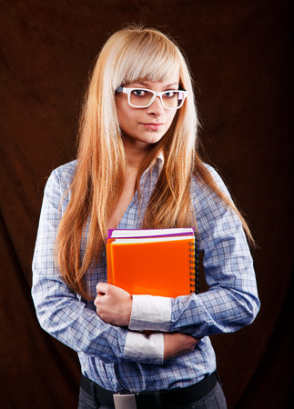 beautiful blonde student with notebooksの写真素材
