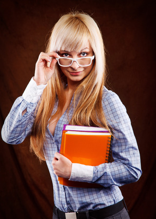 beautiful blonde student with notebooksの写真素材