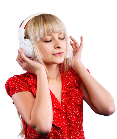 beautiful blonde girl listens to music in the headphonesの写真素材