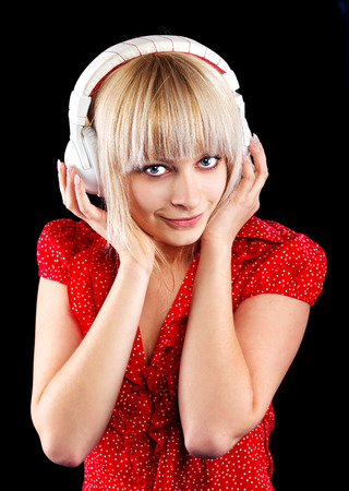 beautiful blonde girl listens to music in the headphonesの写真素材