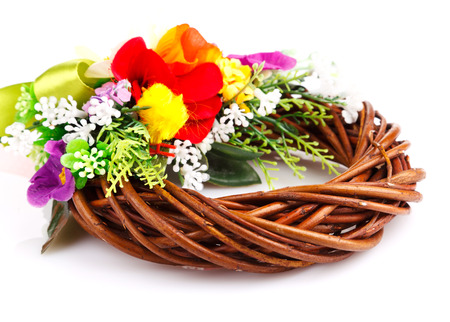 wreath of twigs and flower composition isolated on whiteの写真素材
