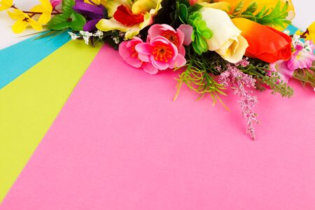 arrangement of artificial flowers with space for captionの写真素材