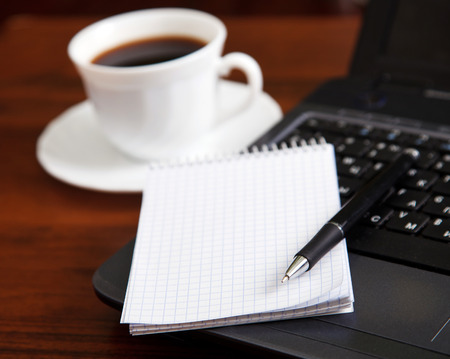 laptop and office on the desktopの写真素材