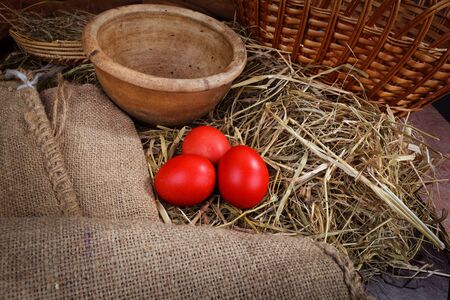 red Easter eggs in the nestの写真素材