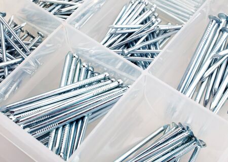 nails in box isolated on whiteの写真素材