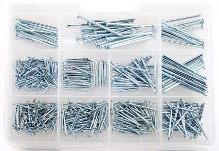 nails in box isolated on whiteの写真素材
