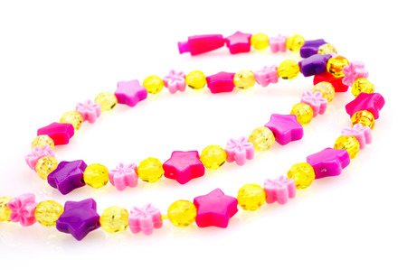 Kids beaded jewellery isolated on whiteの写真素材
