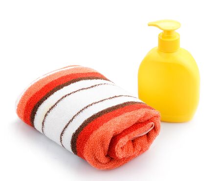 Towels and Soap Dispenser isolated on whiteの写真素材