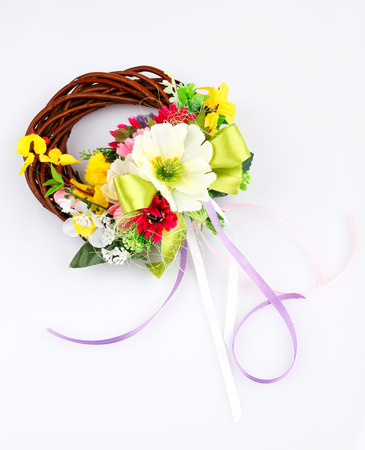 wreath of twigs and flower composition on a white backgroundの写真素材