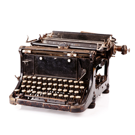Vintage black typewriter isolated on white background.の写真素材