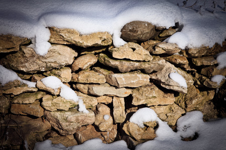 stones covered with snowの写真素材