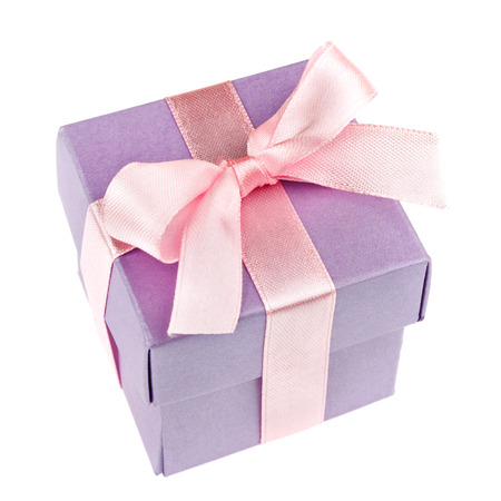 lilac gift box with pink ribbon and bow isolated on white top viewの写真素材