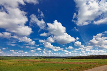 rural landscape with blue sky and incredible cloudsの写真素材