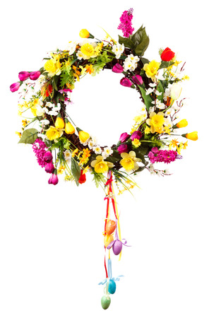Easter wreath with eggs and flowers on a white backgroundの写真素材