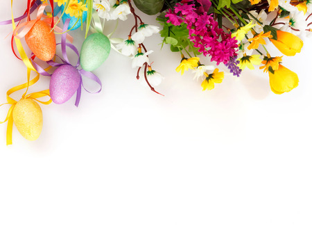 colored easter eggs with flowers on a white background with space for textの写真素材