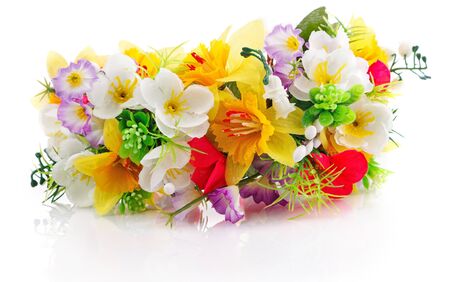 artificial flowers composition isolated on whiteの写真素材