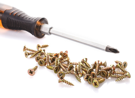 Screws and screwdriver isolated on white background.の写真素材