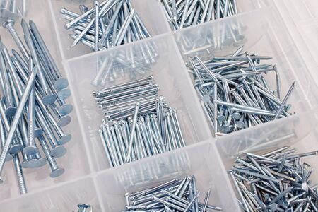 nails in box isolated on whiteの写真素材