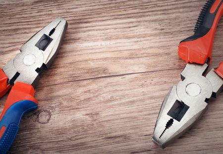 combination cutting pliers on wooden  backgroundの写真素材