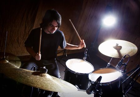 drummer playing his drum setの写真素材