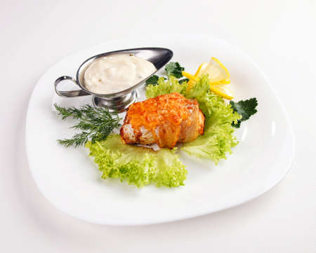 meat sauce with lemon and salad isolated on whiteの写真素材