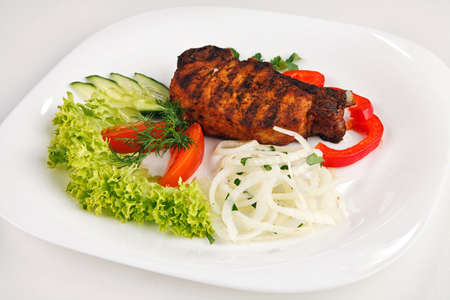 juicy  gril steak with salad on the white plate isolatedの写真素材