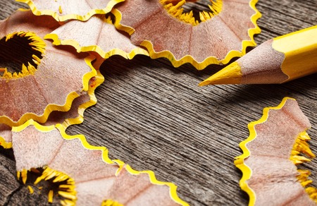 pencil and shavings on wooden background, space for your textの写真素材