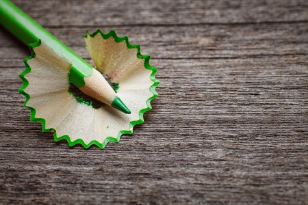 pencil and shavings on wooden background, space for your textの写真素材