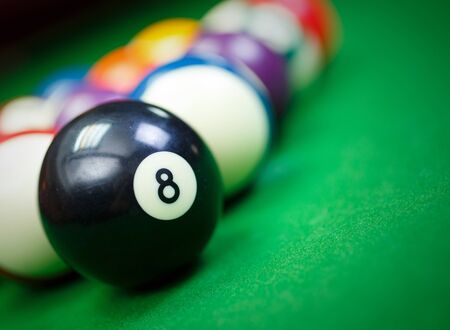 Different points of view billiard balls on a blue pool table,Black number eightの写真素材