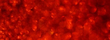 Abstract redglitter background. Shiny glitter bokeh christmas backgroundの写真素材
