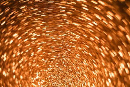 Abstract gold glitter background. Shiny glitter bokeh christmas background.twisted circleの写真素材