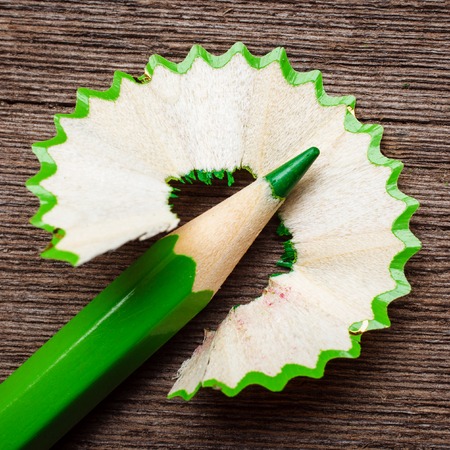 pencil and shavings on wooden background, space for your textの写真素材