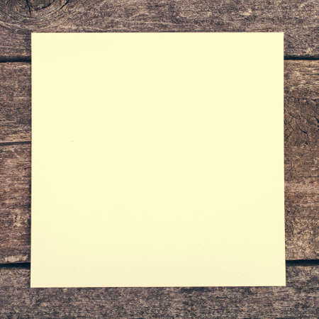 grunge wooden background with blank paperの写真素材