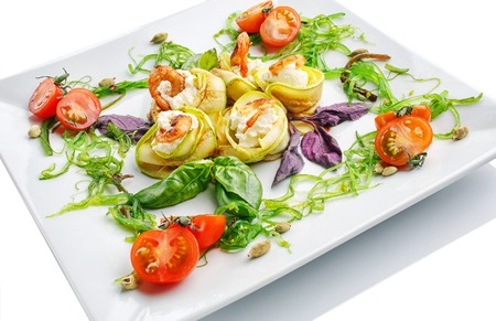 appetizing restaurant food - salad of greens, vegetables and shrimps on  white backgroundの写真素材