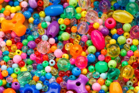 Lots of colorful fusible plastic beads used for arts and craft
