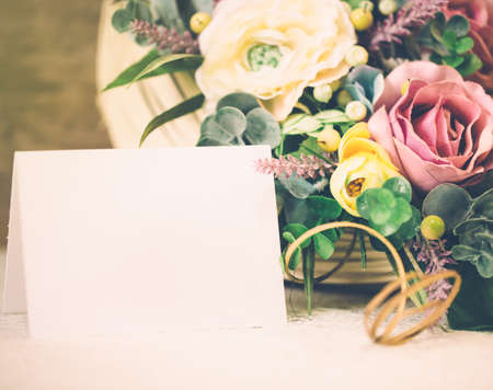 delicate floral bouquet with blank card for text, postcard for congratulationの写真素材