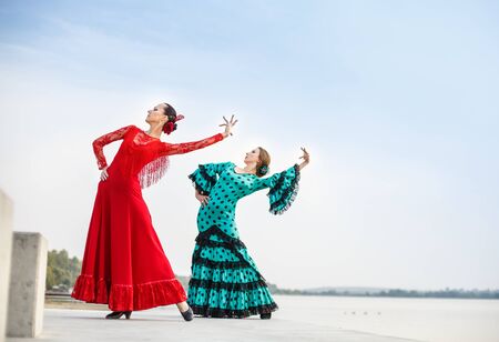 Flamenco dancers Spain woman in a long dress on the lakeの写真素材
