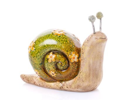 snail toy figurine on a white backgroundの写真素材