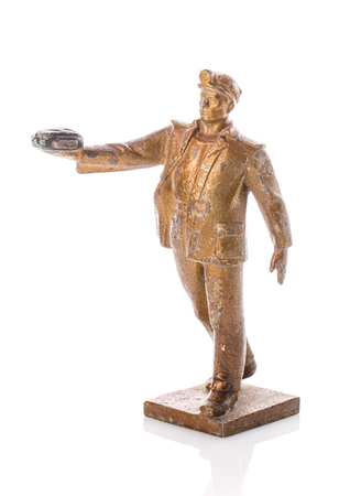 Figure miner who holds coal in his hand on a white backgroundの写真素材