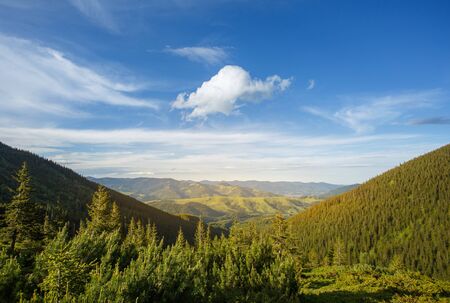 summer mountain landscape with blue sky and white clouds. The greatness of natureの写真素材