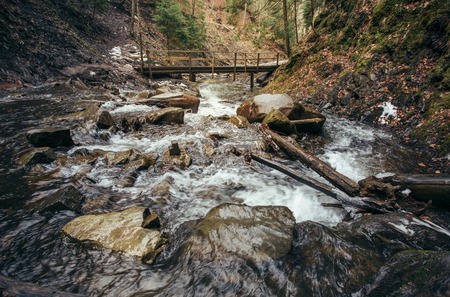 mountain river and wooden bridge