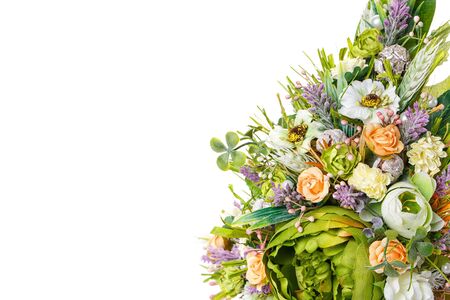 basket with flowers to celebrate Easter on a white backgroundの写真素材