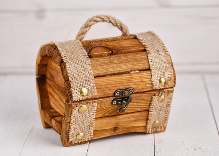 Old wooden chest against a background of white boardsの写真素材