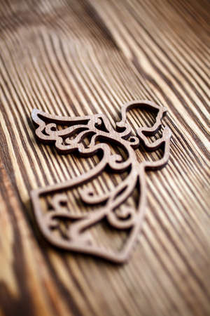 Christmas angel ornament on rustic style wooden backgroundの写真素材