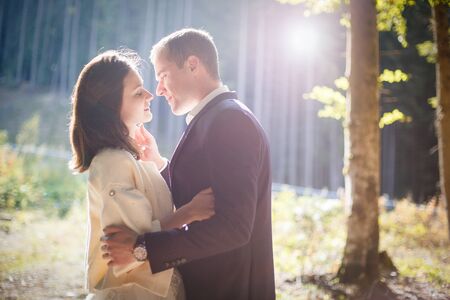 Image of a happy young couple spending time outdoor in the autumn parkの写真素材